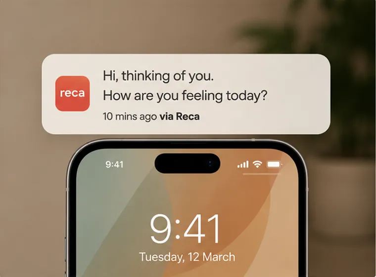 A phone notification from Reca reading Hi, thinking of you, how are you feeling today