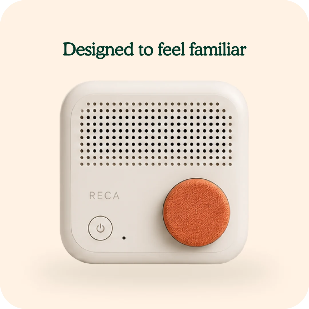 The Reca AI companion device on a plain background, showing its speaker grille, power button and volume knob